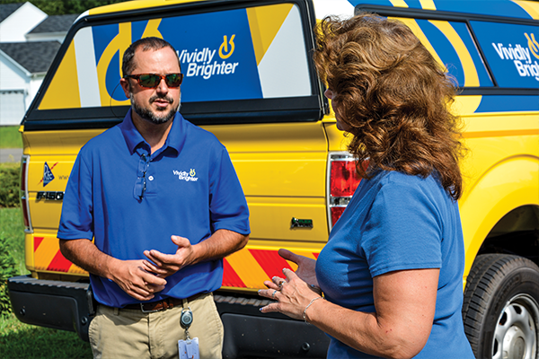 REC employee talking to Member