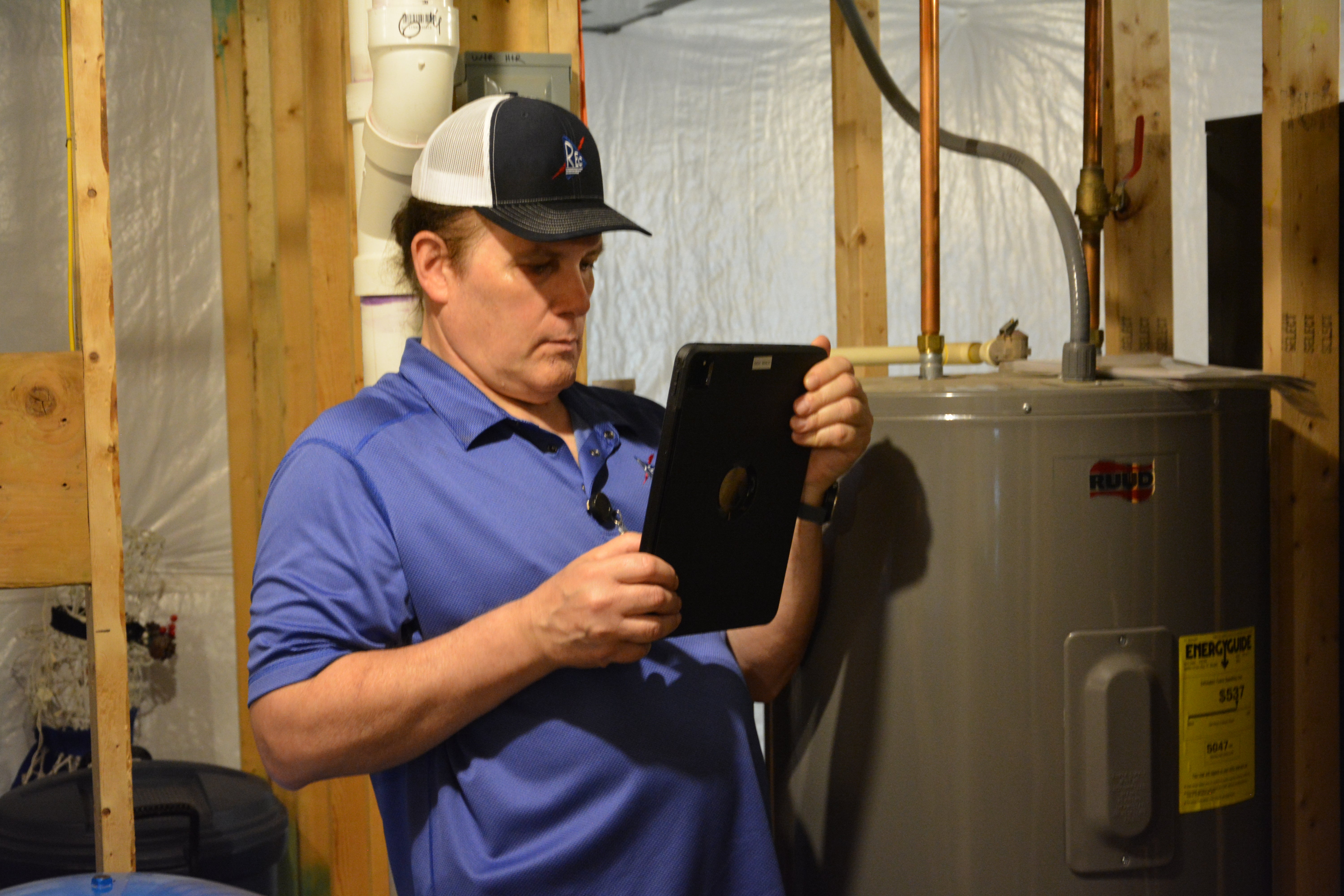 Technician inspecting a residential water heater