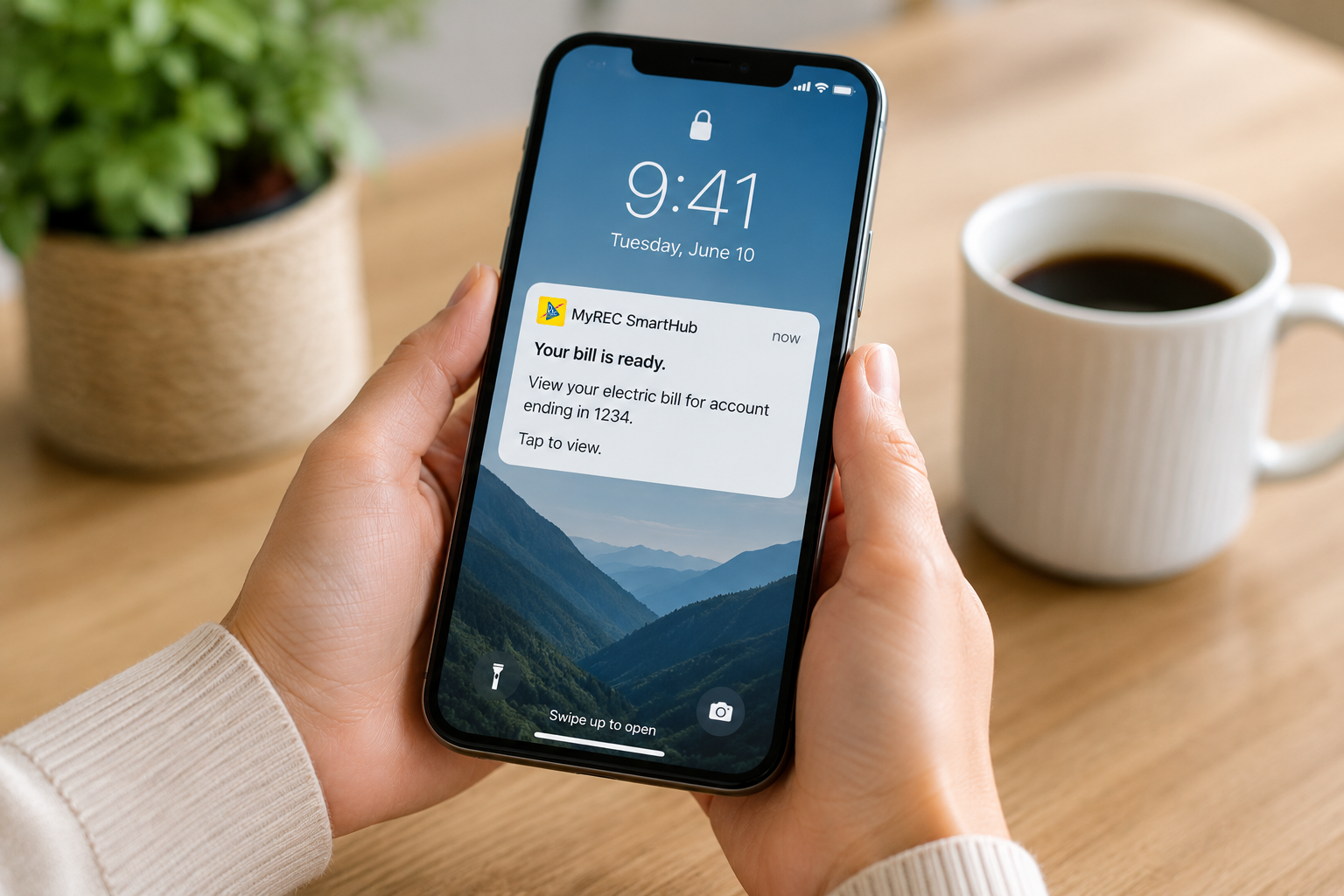 Member viewing an electric bill notification on a smartphone