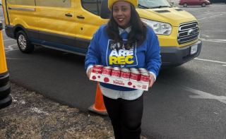 REC brings canned goods to Camping for Hunger in Winchester.