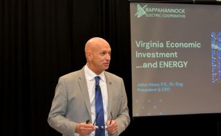 Photo of John Hewa, President & CEO of REC